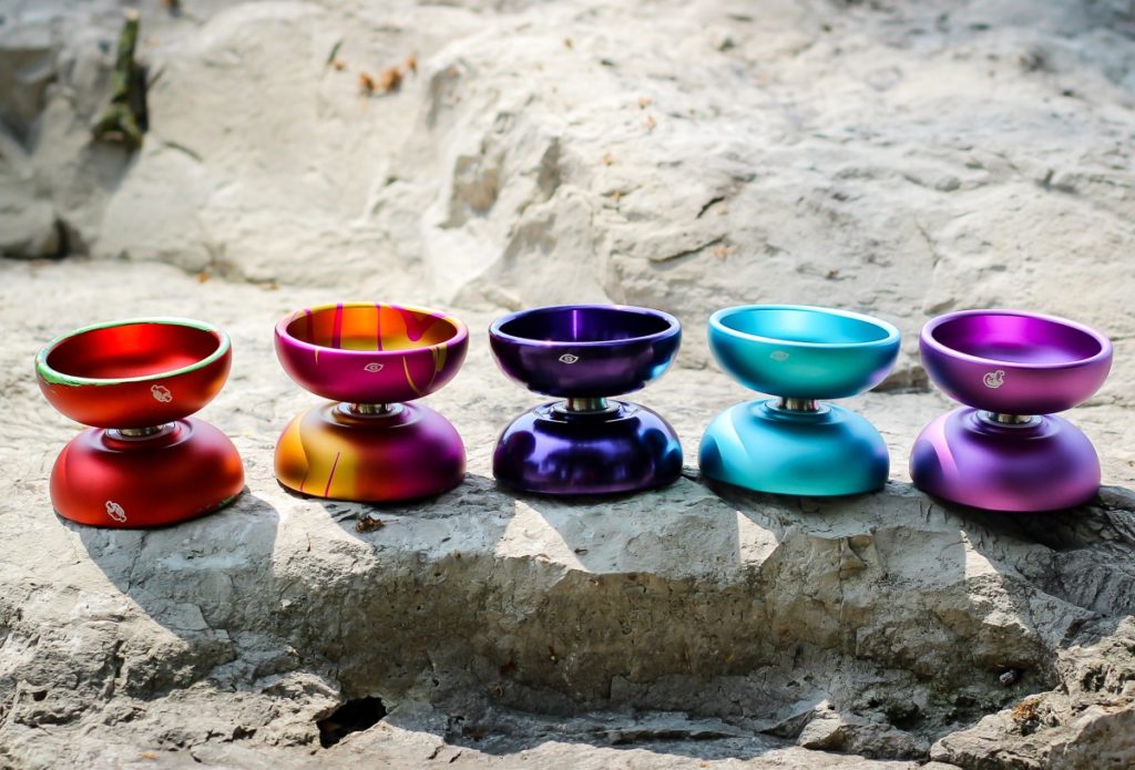 photo of five mk1 contact yoyos sitting on a rock